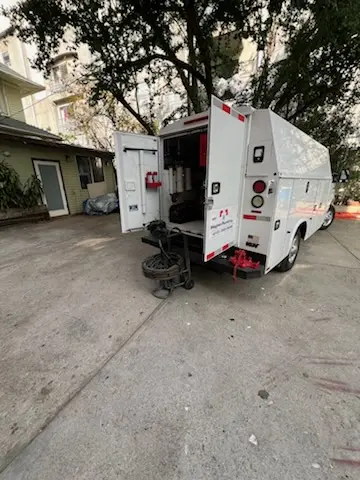 Magnet Plumbing service vehicle on-site for Grease Trap Cleaning in Country Club Village